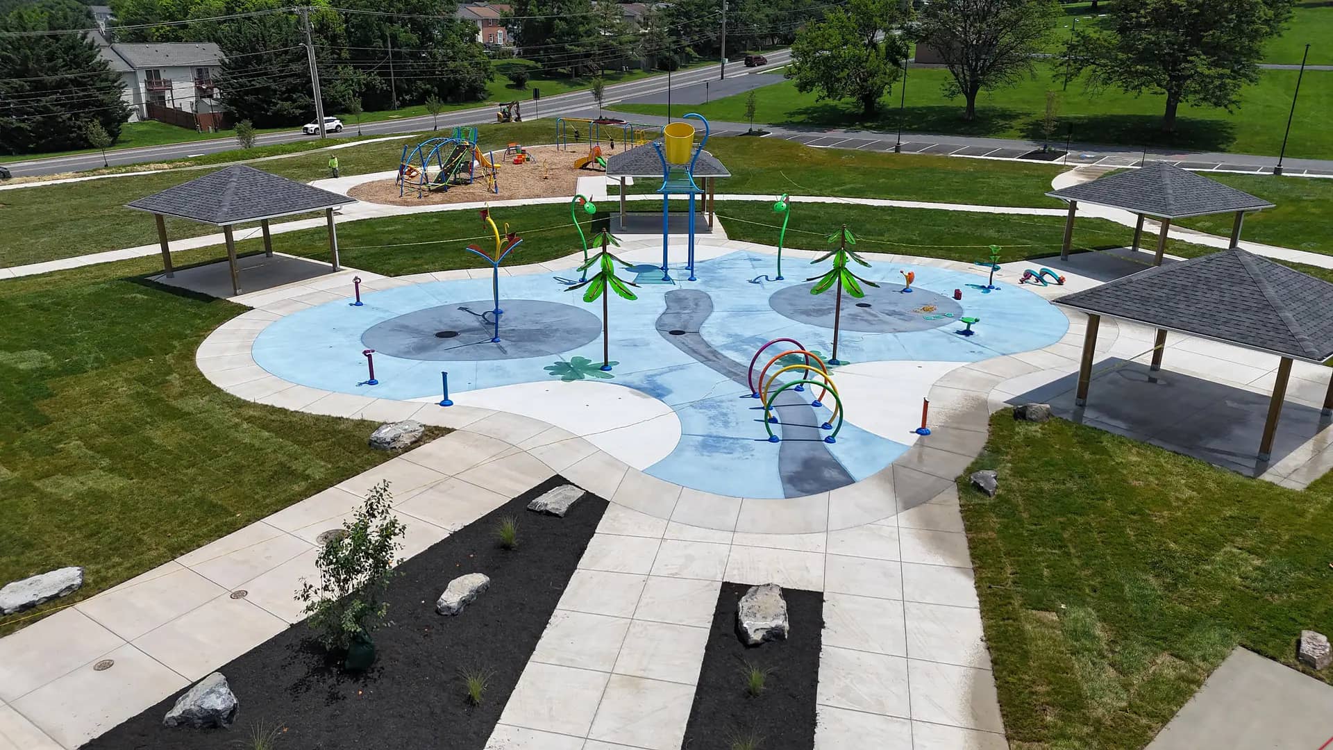 Overhead view of Ralph Sampson Spraygrounds in Harrisonburg showing the large splash play layout.