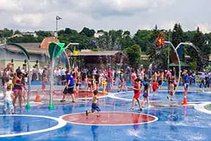 Kids playing in the spray park at Cristoforo Colombo East Park in Worcester.