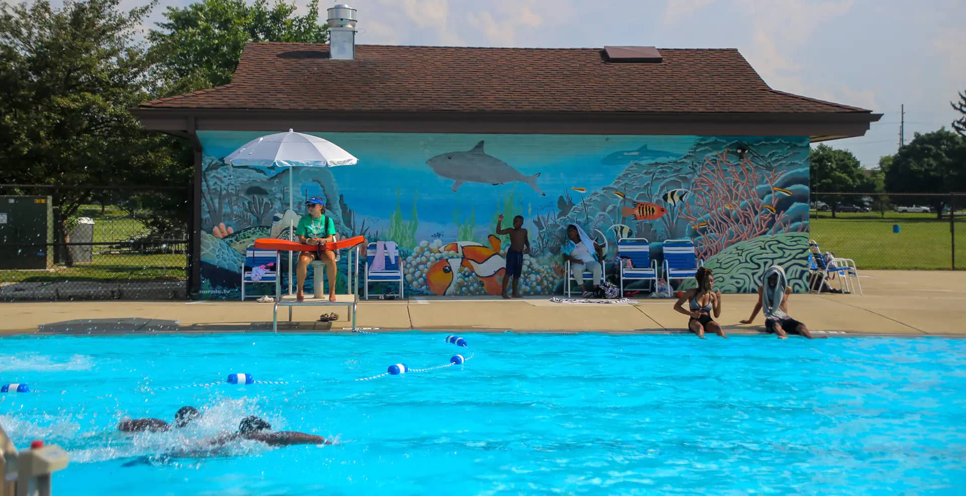 Families enjoying an Indy Parks aquatic facility during summer season.