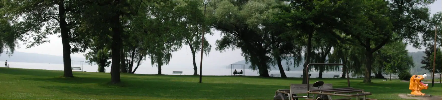 Panoramic view of Stewart Park in Ithaca, home to a seasonal spray pool and playgrounds.