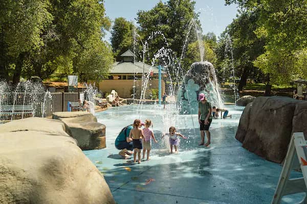Fantasy Fountain Splash Park in Redding with water sprays and surrounding park amenities.