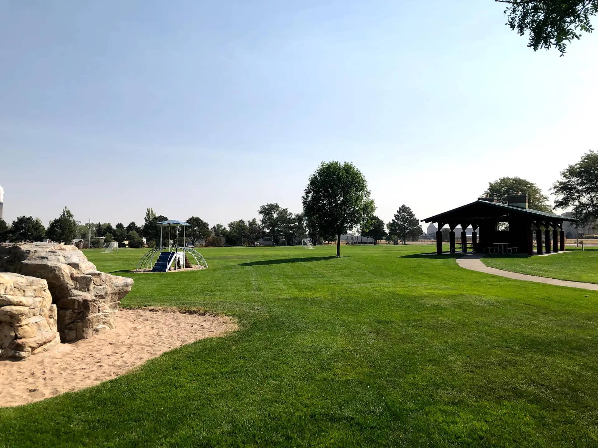 Shelter and play area at Veterans Park in Scottsbluff, home to the park's splash pad.