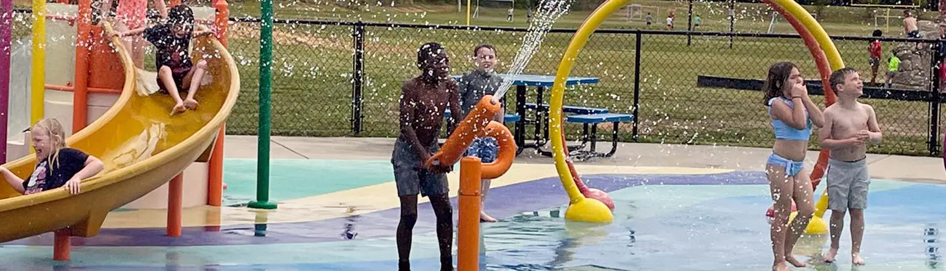Children's splash pad area at Melvin Park in Chapin.