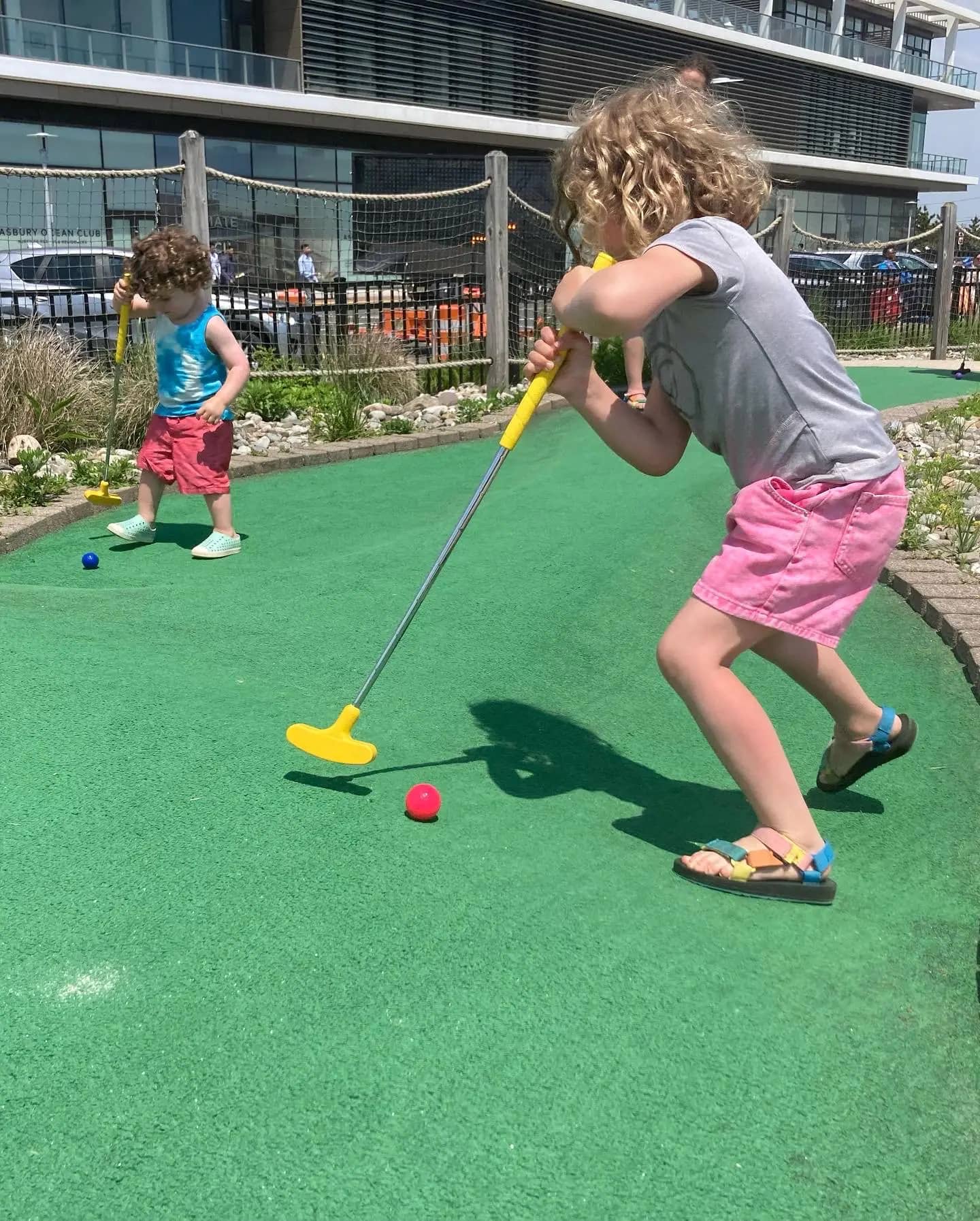 Children playing in spray features at Asbury Splash Park.