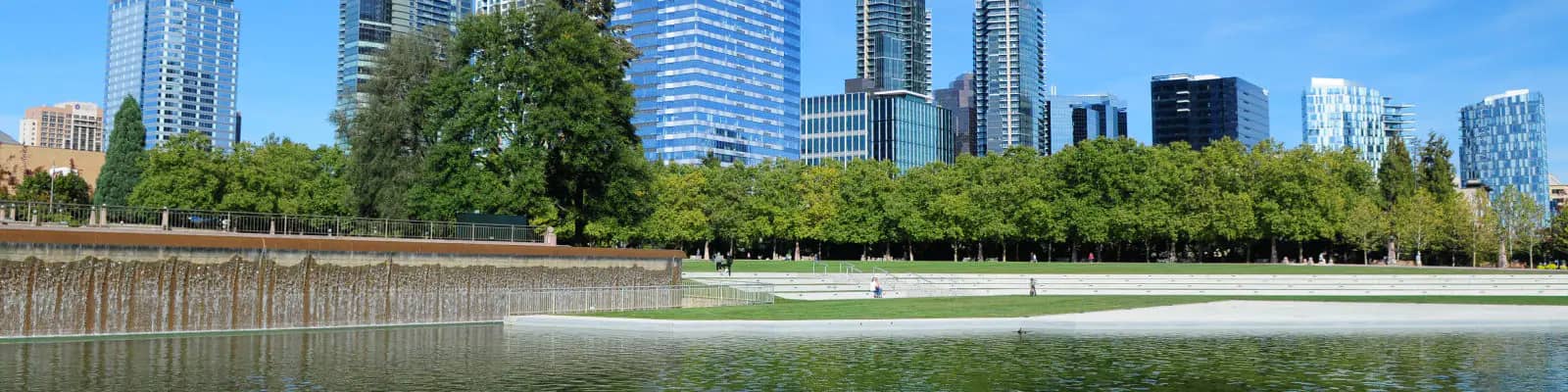 Bellevue Downtown Park with lawn and promenade near the water spray playground.
