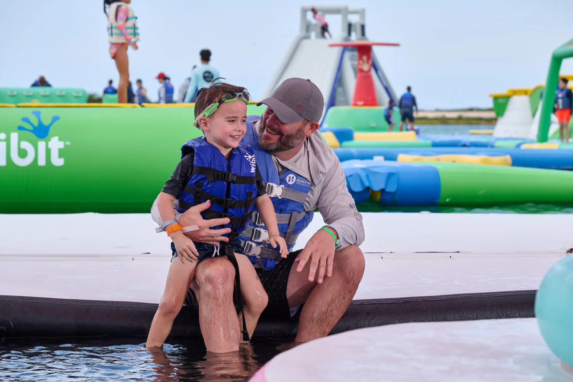 Families using the Wai Kai Ohana Splash Pad.