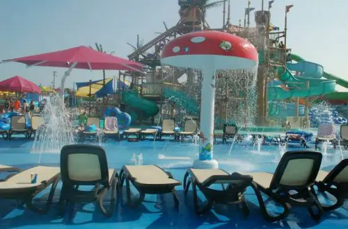 Official Jolly Roger splash pad image with fountains and seating nearby.