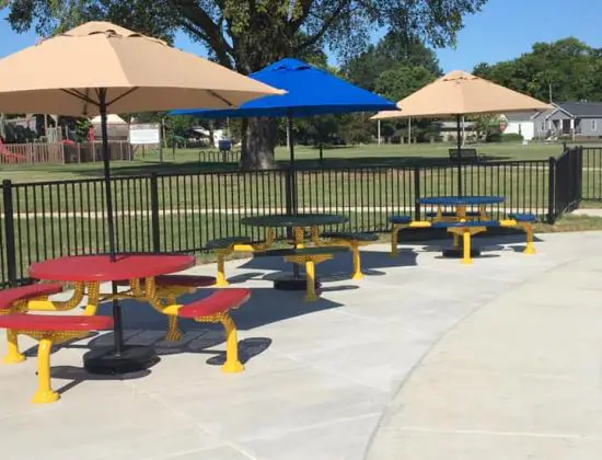 Picnic benches beside the splash pad at Rotary Health Park.