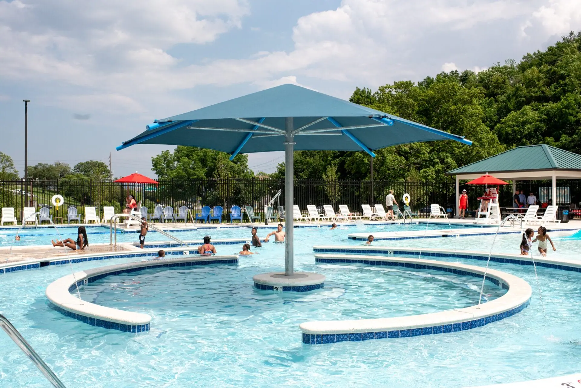 Washington Park Pool splash and leisure area in Roanoke with shallow-entry water play features and seating.