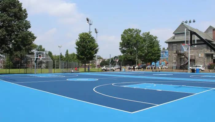 Renovated basketball courts at F.J. Myers Recreation Center, where the site also includes a sprayground and pool.