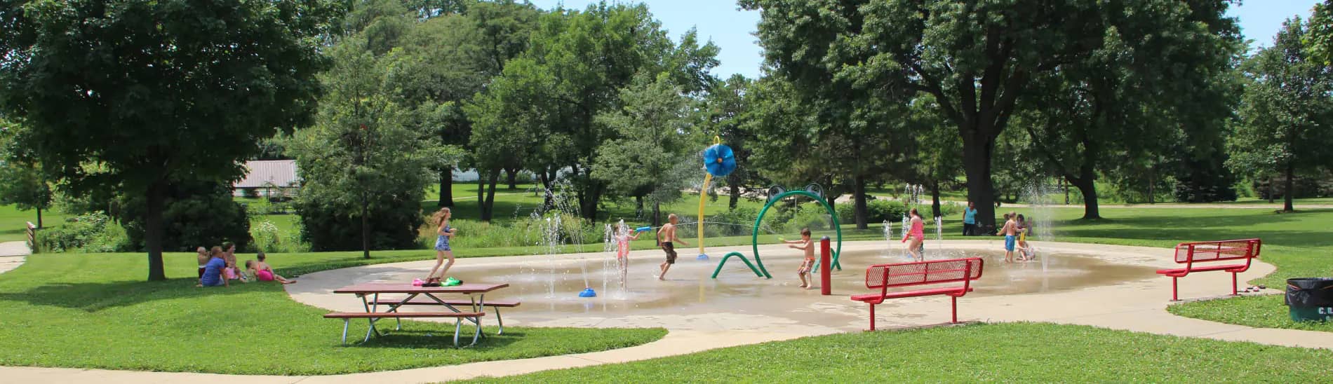 Children enjoying the splash pad at Noelridge Park in Cedar Rapids.