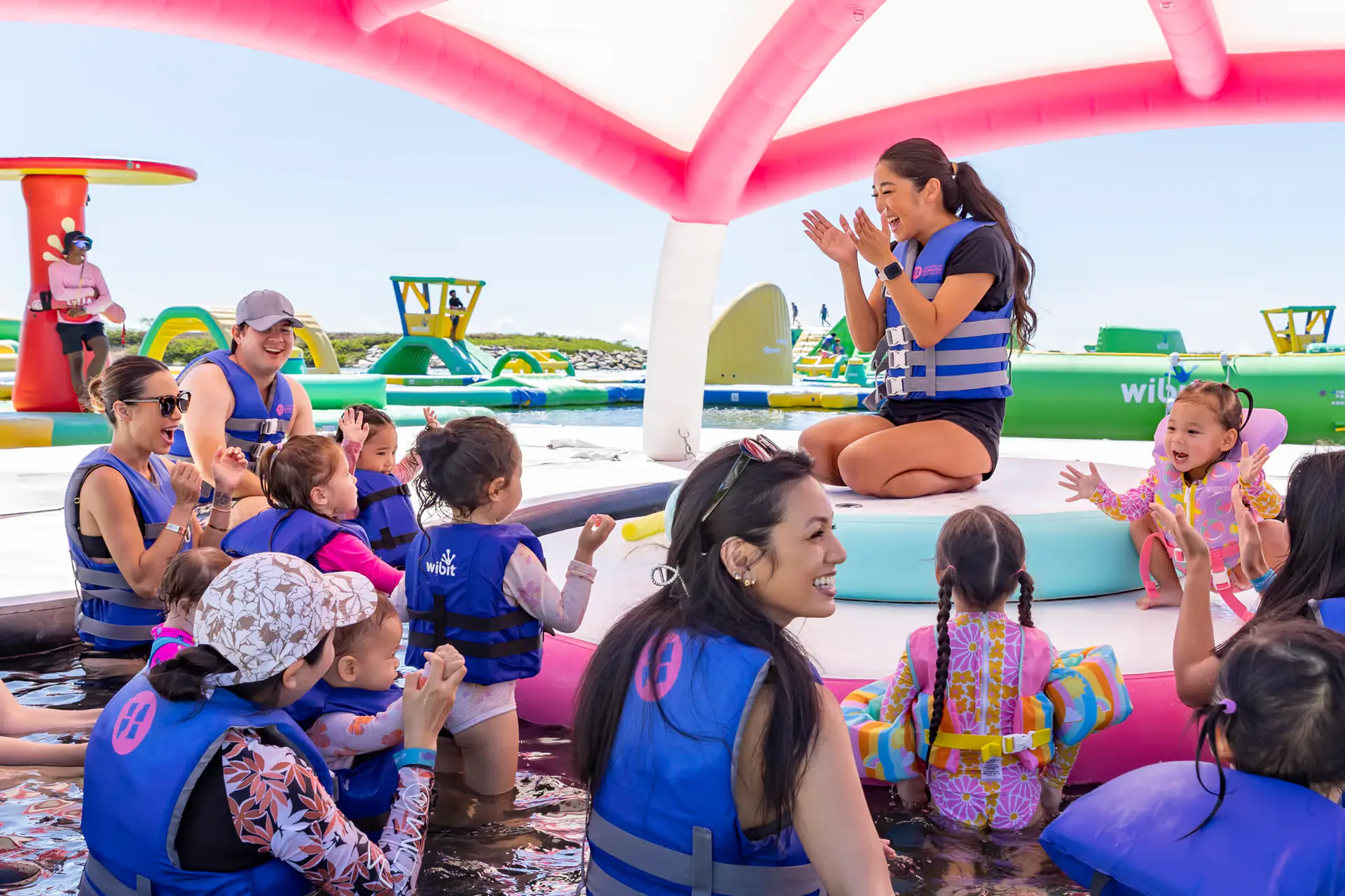 Children and caregivers enjoying the Wai Kai splash area.