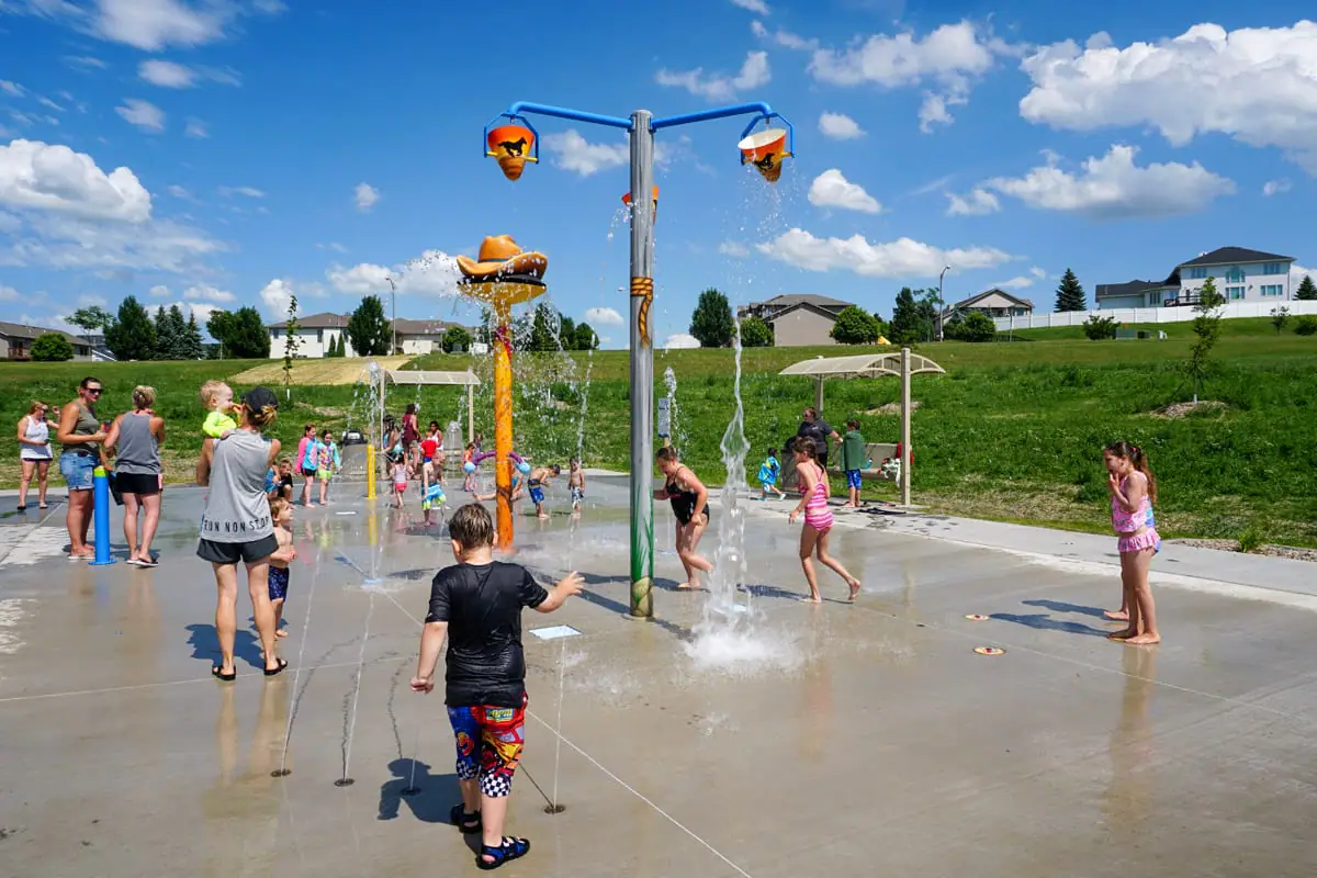 Children playing on the splash pad at New Generations Park in Bismarck.