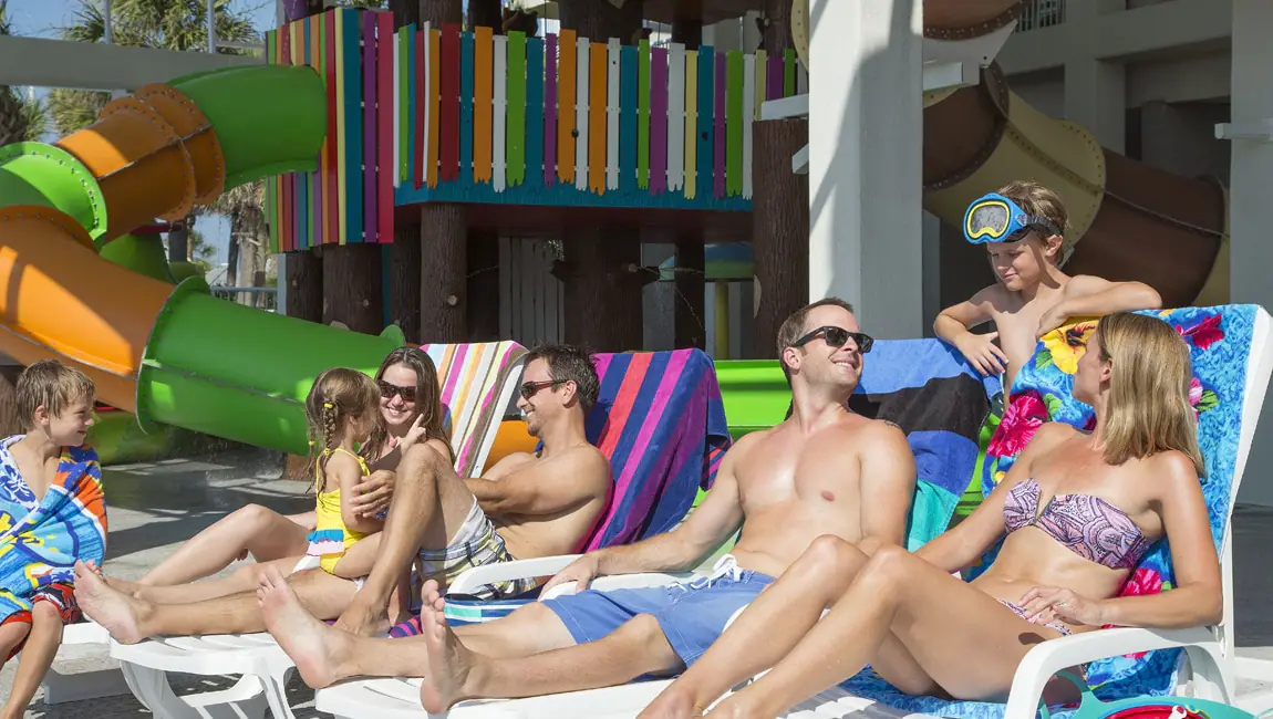 Family enjoying the splash zone at Crown Reef Resort.
