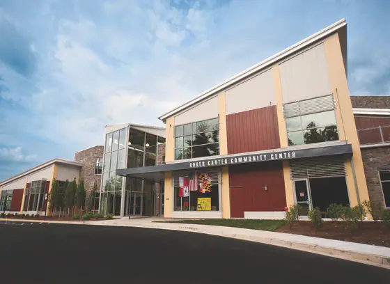 Front exterior of Roger Carter Community Center in Ellicott City, home to a pool and splash pad.
