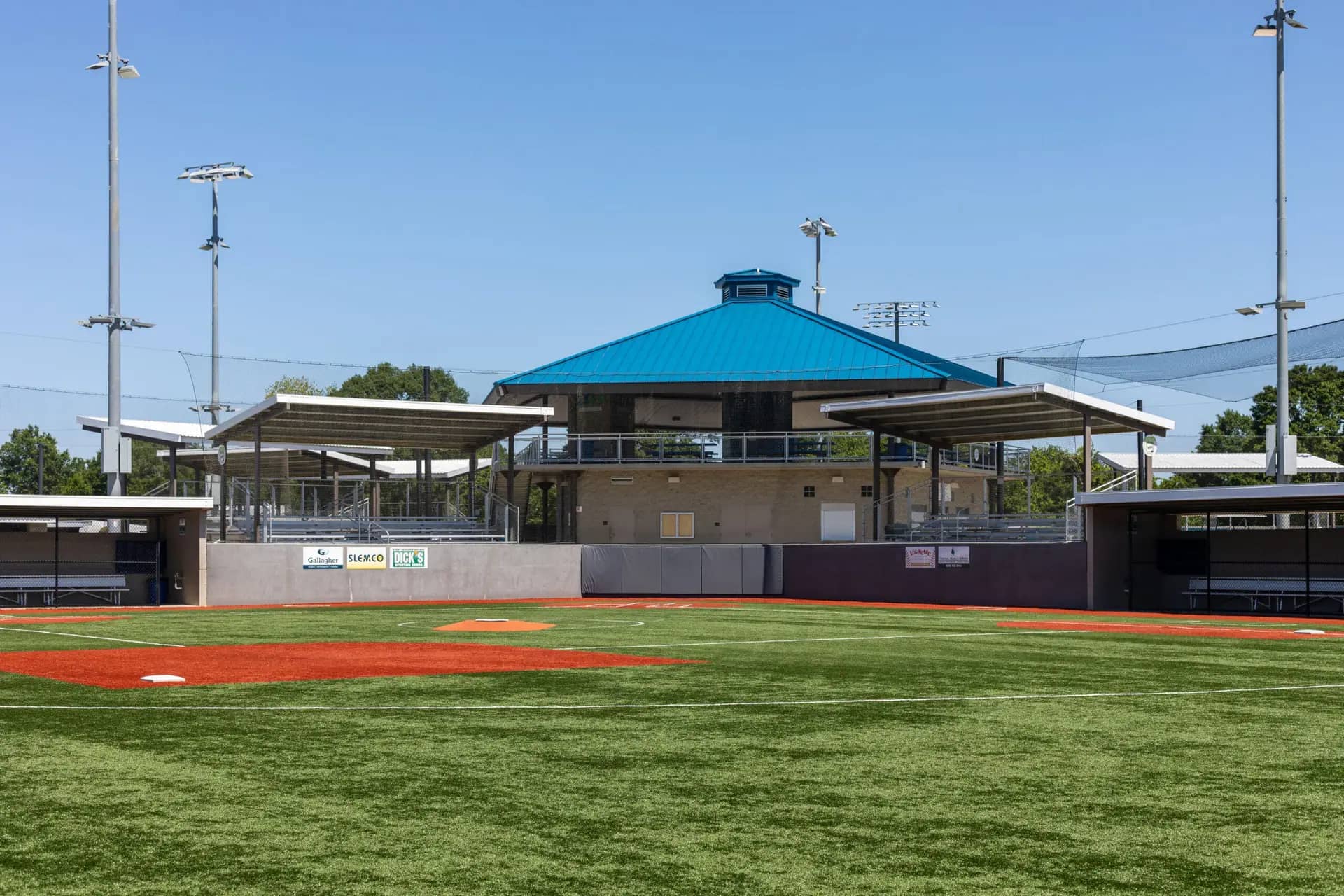 Water play area and surrounding amenities at Broussard Sports Complex.